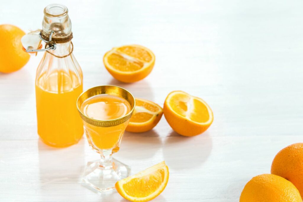 A tall glass of homemade orange liqueur.