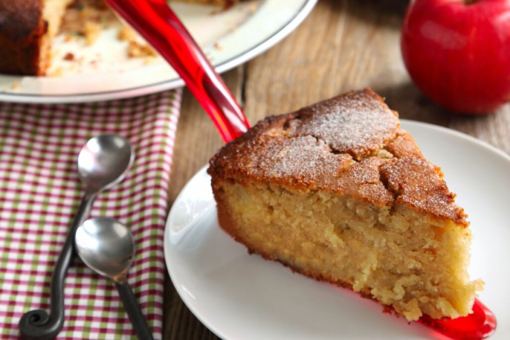 A slice of applesauce cake made with homemade applesauce.