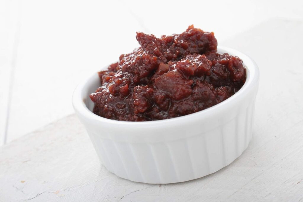 A fiery and tasty bowl of smoked chipotle peppers in adobo sauce.