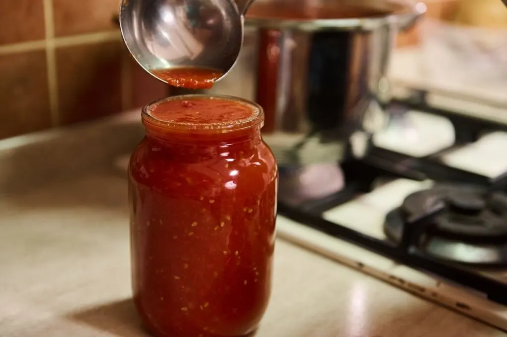 A jar of homemade tomato juice.
