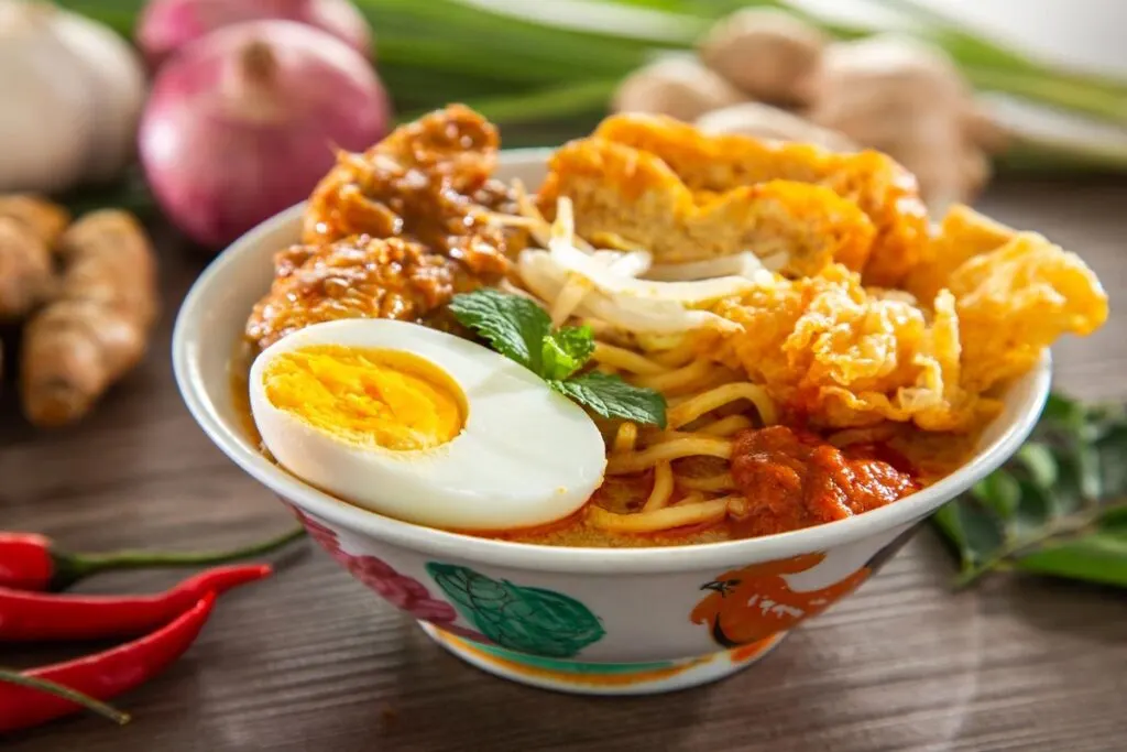 A bowl of delicious Southeast Asian flavored curry laksa.