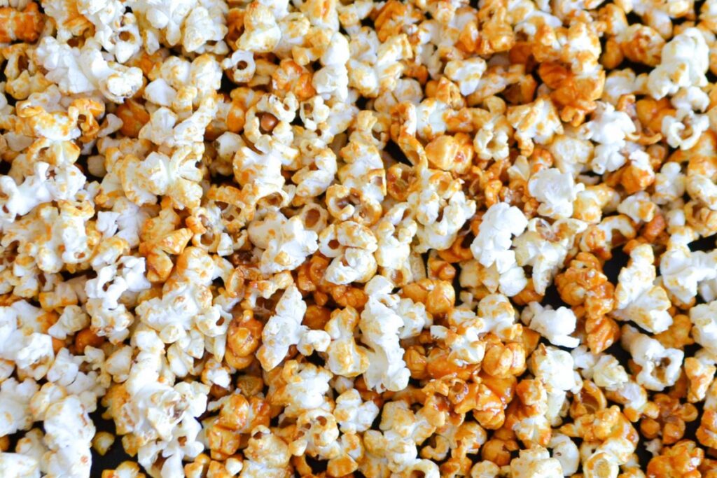 A closeup of a batch of hot sauced popcorn.