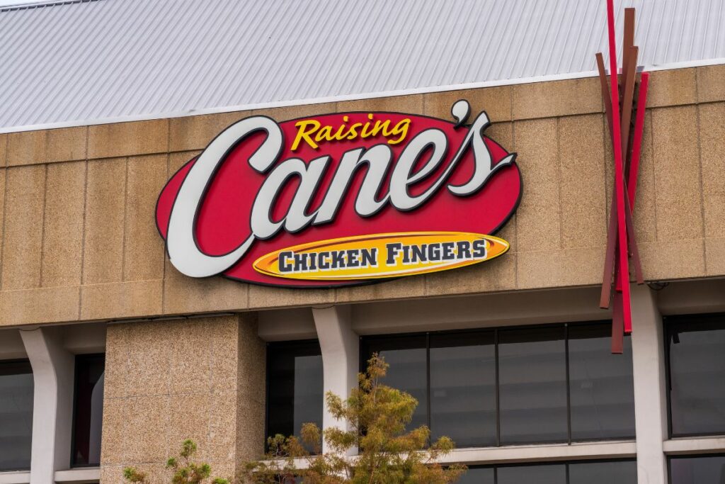The front of a Raising Cane's restaurant.