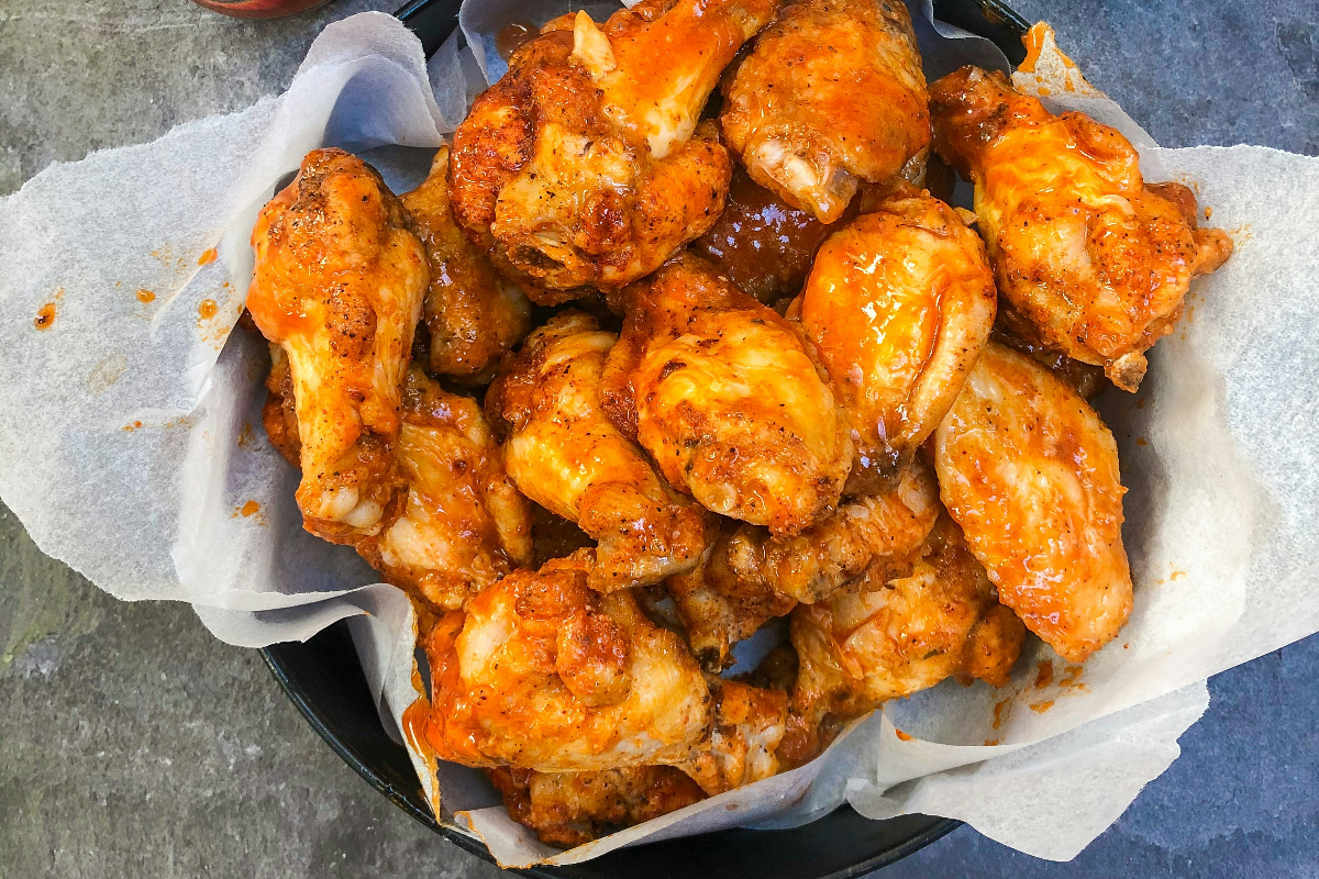 Denny's buffalo sauce poured onto their wings.