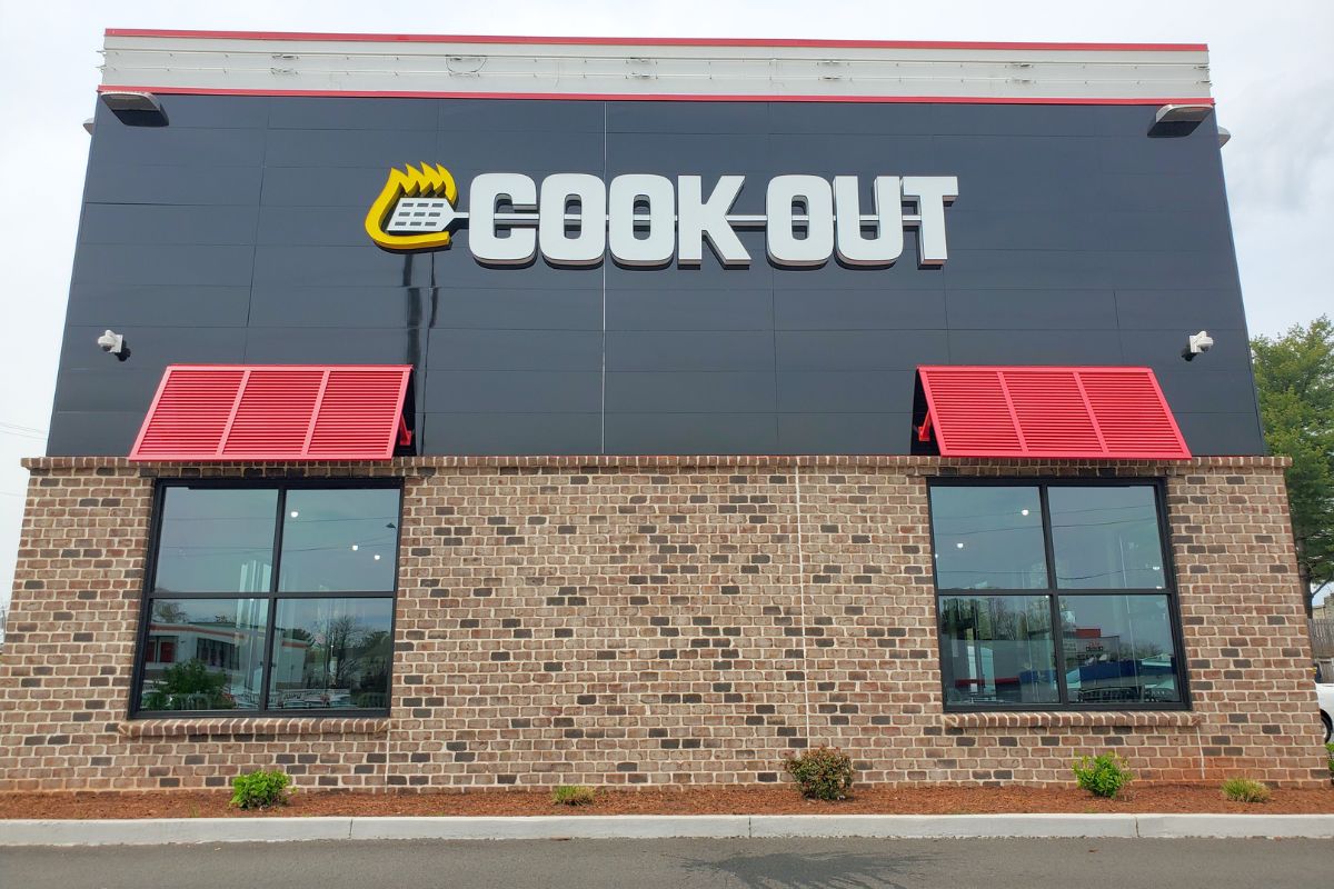 Front view of Cook Out fast food with its logo signage.