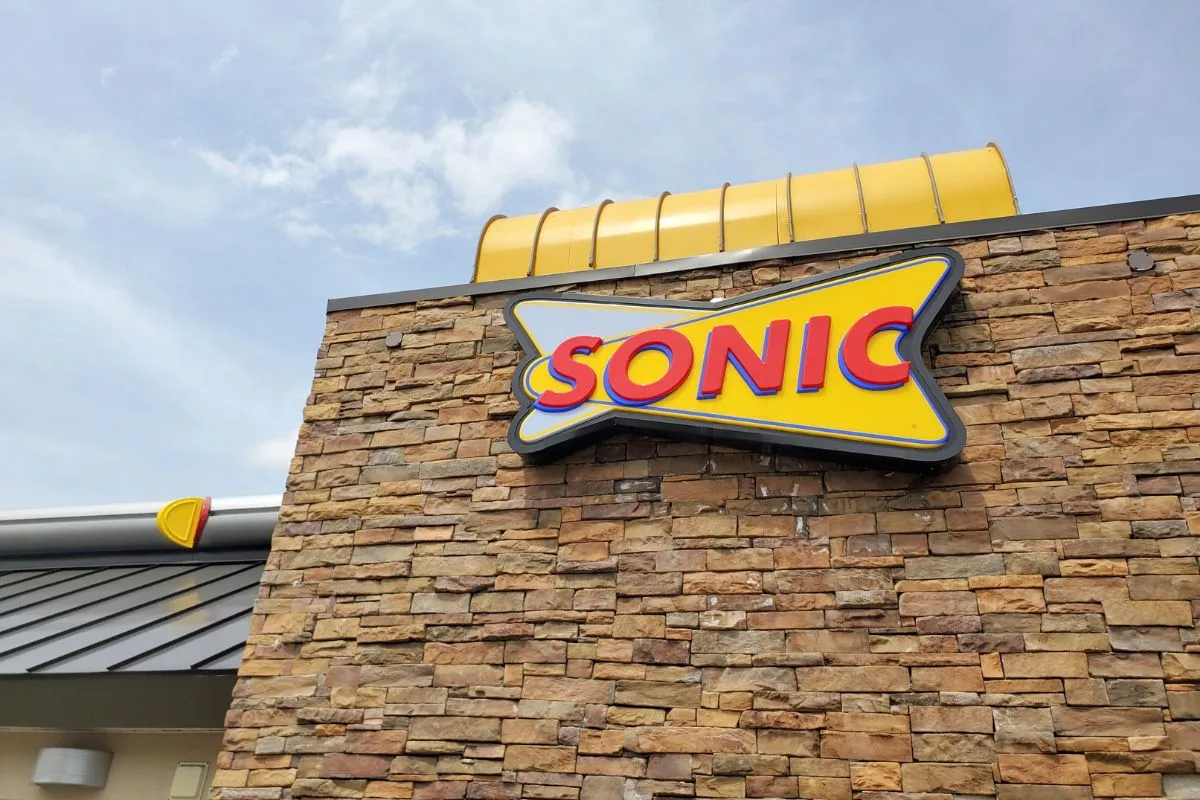 A logo signage of Sonic Drive-In.