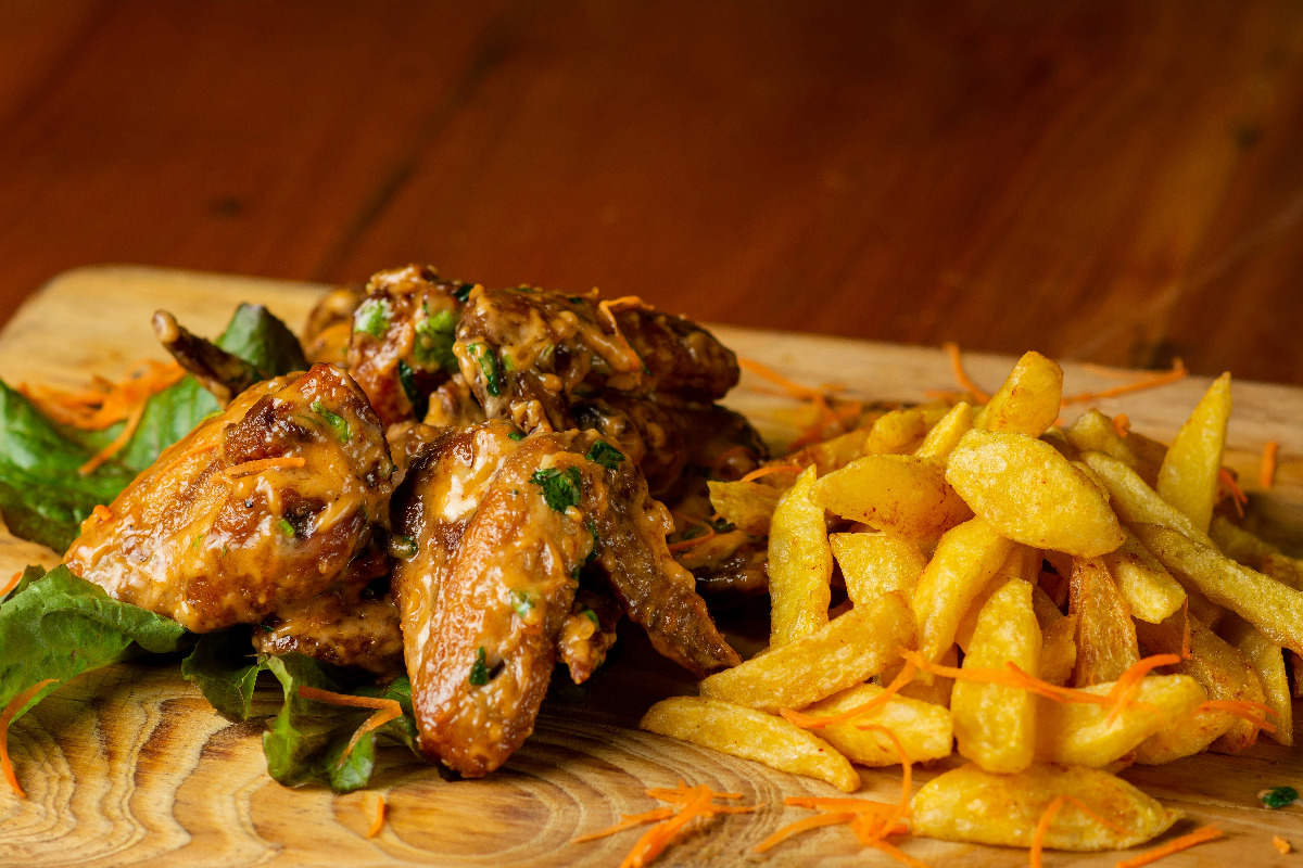 Chicken wings sauced with mango habanero sauce.