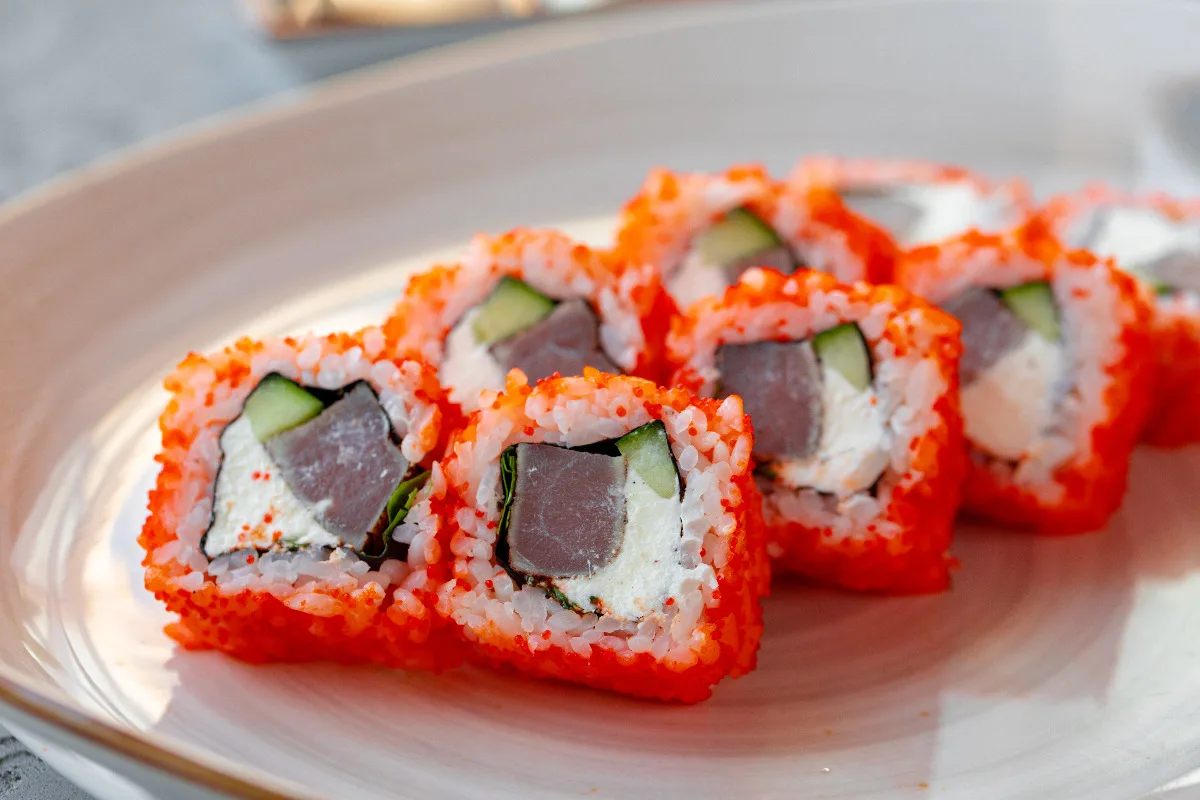 A plate of delicious California rolls.
