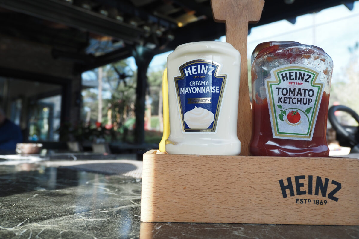 A bottle of Heinz mayonnaise and Heinz ketchup.