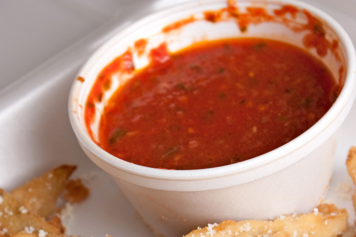 Dipping cup of Papa John's pizza sauce.