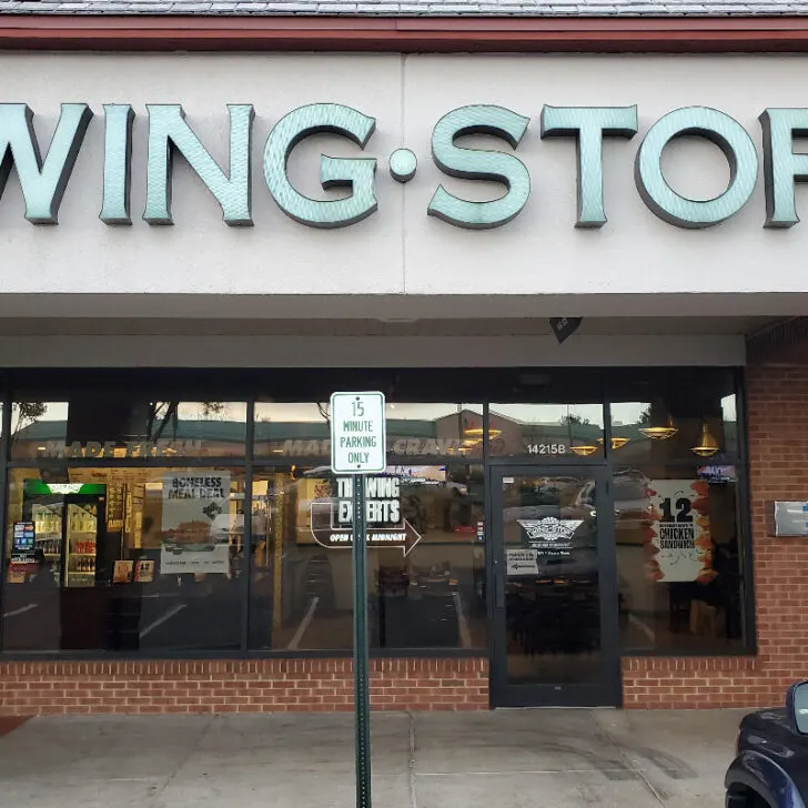 The outside of a Wingstop restaurant.