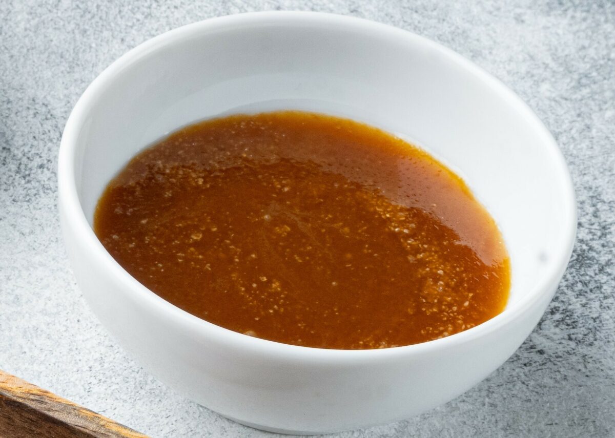 A sauce bowl of Auntie Anne's caramel sauce.